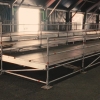 Plateforme VIP en échafaudage Layher montée par PROG event sous chapiteau